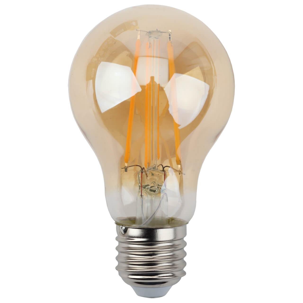 Лампа светодиодная филаментная ЭРА E27 9W 2700K золотая F-LED A60-9W-827-E27 gold. 