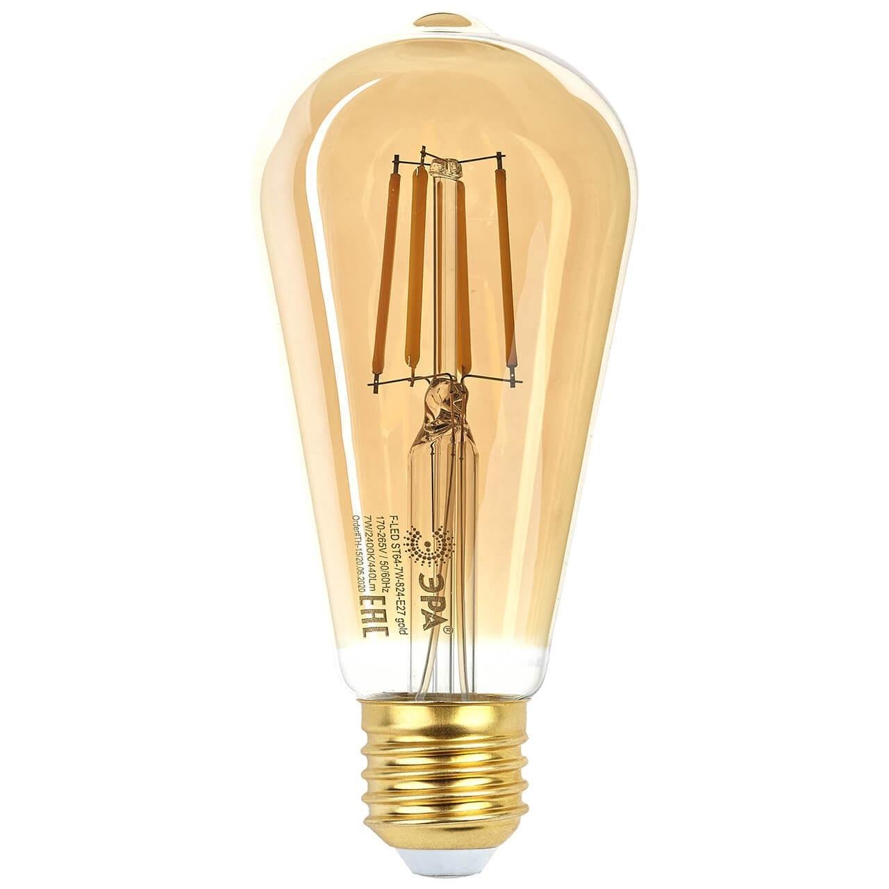 Лампа светодиодная филаментная ЭРА E27 7W 2400K прозрачная F-LED ST64-7W-824-E27 gold Б0047664. 